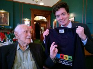 Frank Rushbrook with Rory Hadden holding a BRE Centre t-shirt